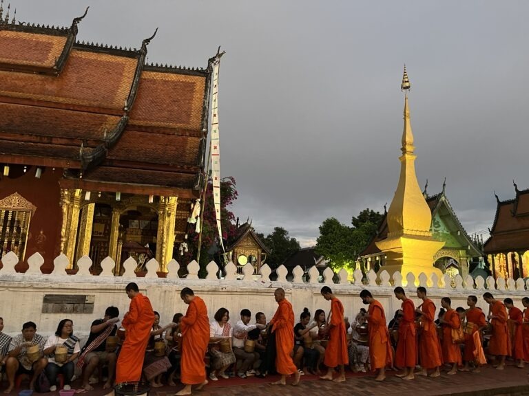 Monks alms temple Laos