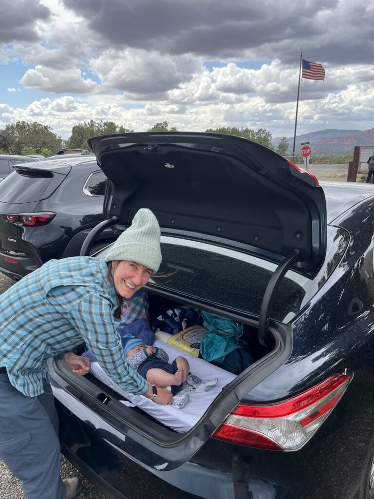 Changing diapers in the trunk of a car