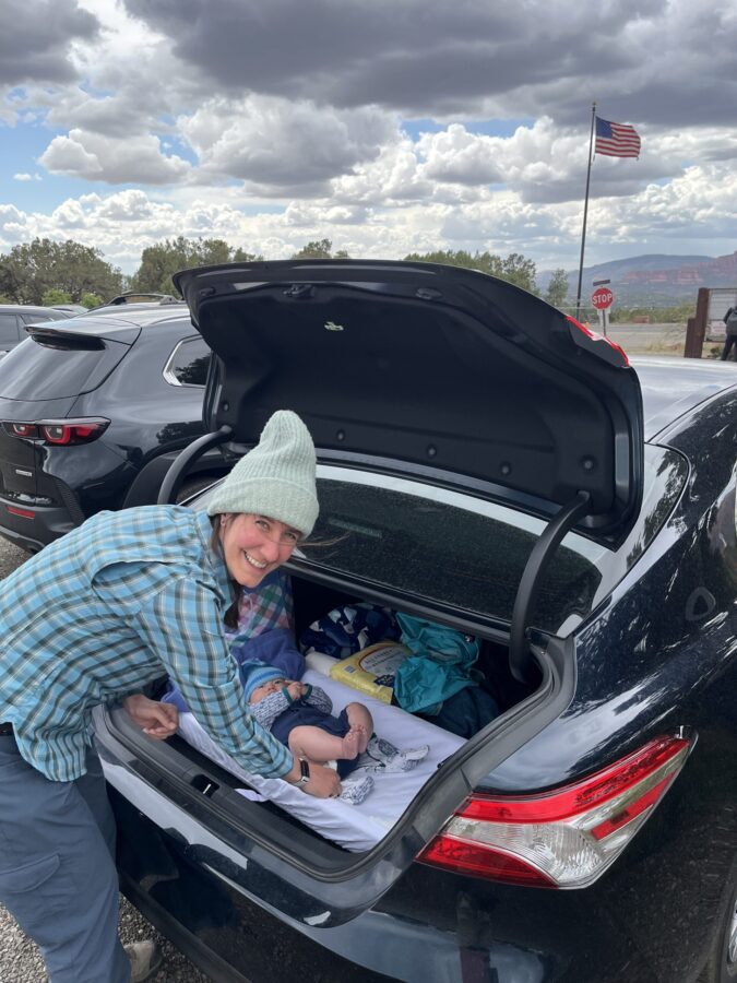 Changing diapers in the trunk of a car
